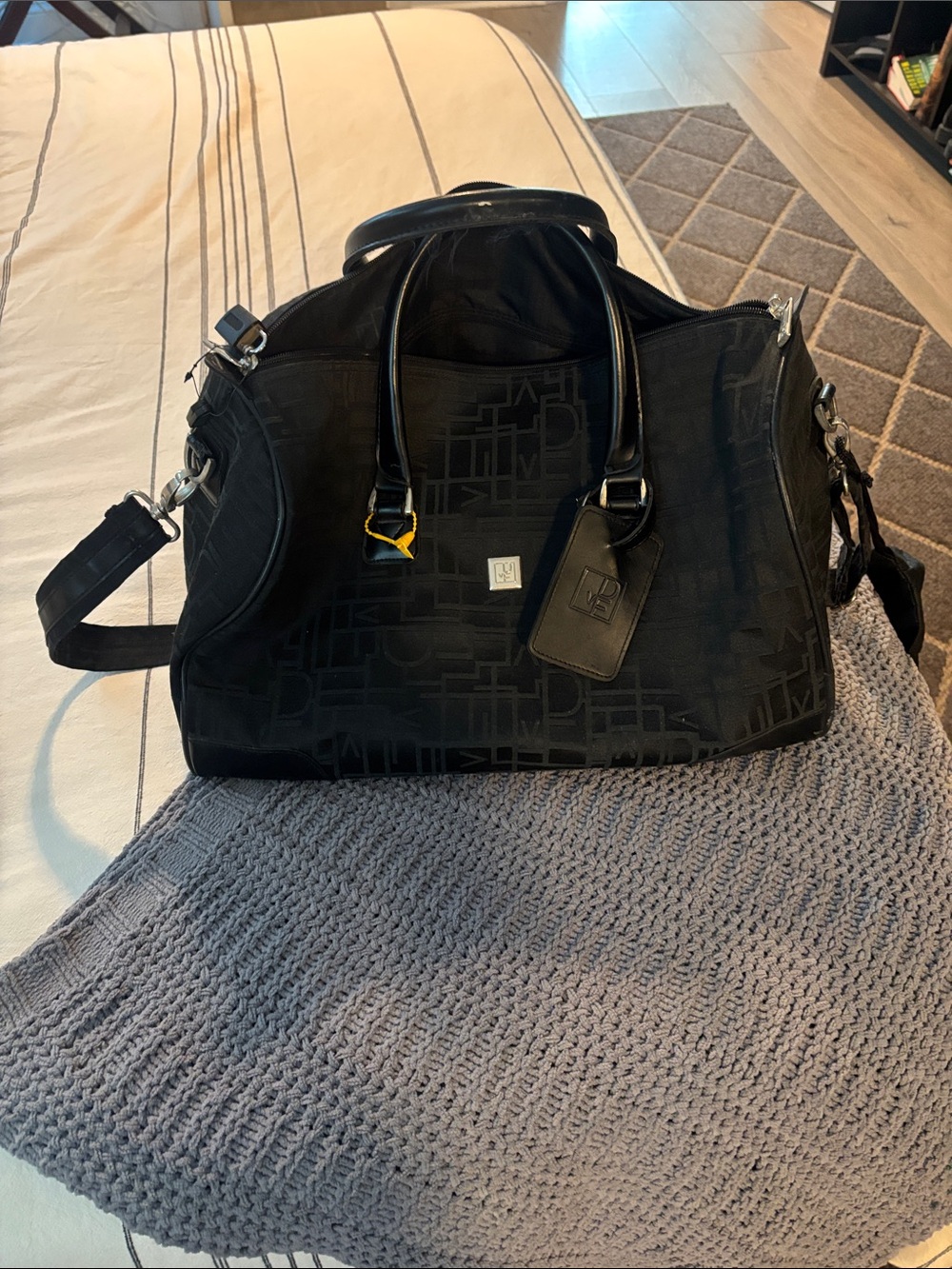 Black DVF Weekender Duffel Bag - with handles, lock and keys, and shoulder strap
